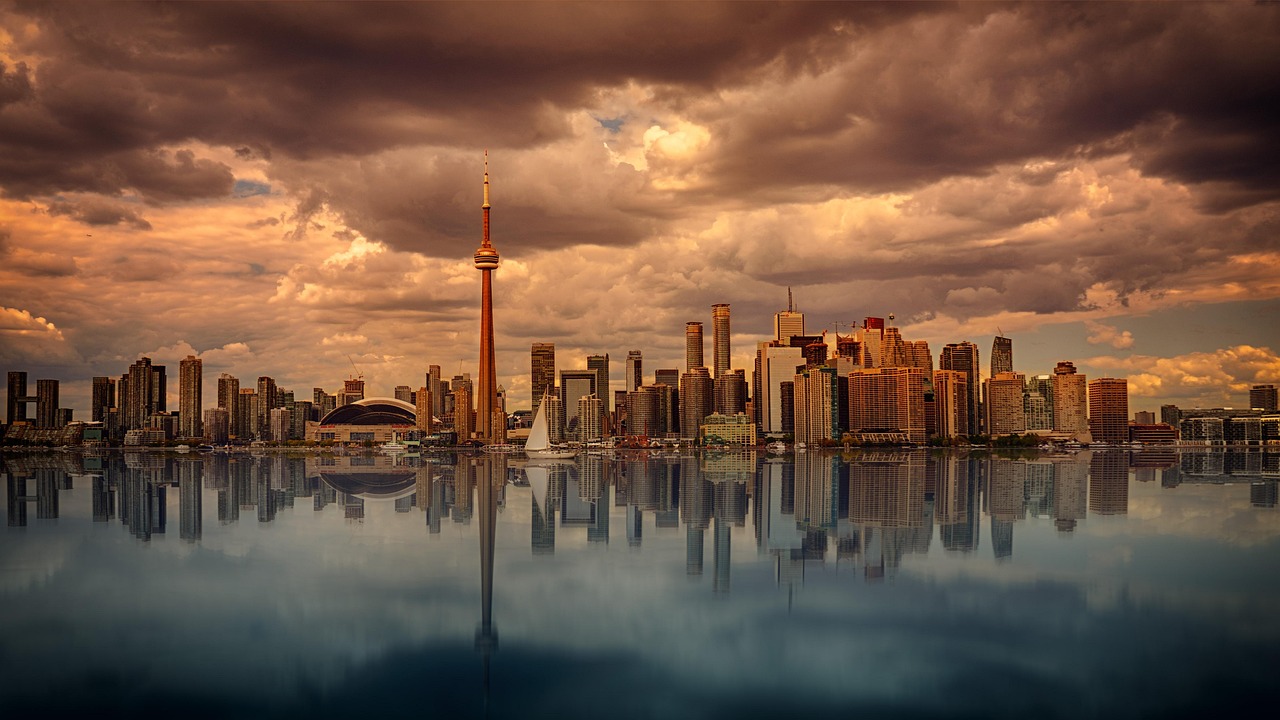 Flights to Toronto (YYZ) - CN Tower and Toronto skyline - book airline tickets